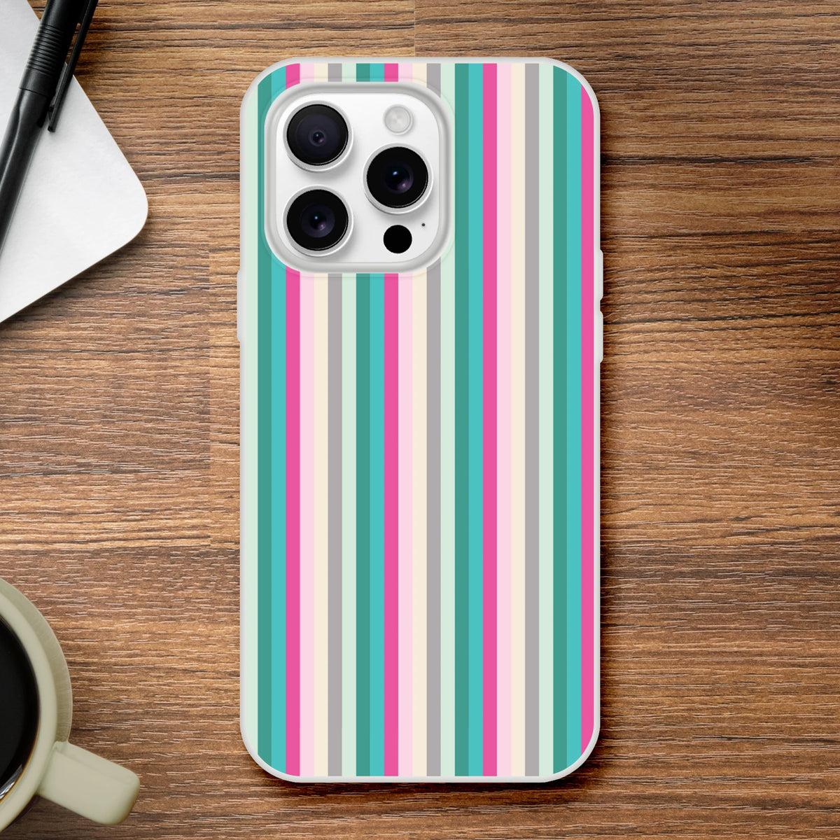 Pastel Stripe iPhone Case (13-16) with colorful vertical stripes on a wooden desk.