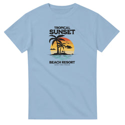 Sunset women's graphic tee with tropical palm trees and sunset on light blue cotton blend, sizes S–XL.