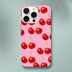Pink iPhone case featuring a seamless red cherry pattern on a vibrant hot pink background, designed for tough protection and stylish daily carry.