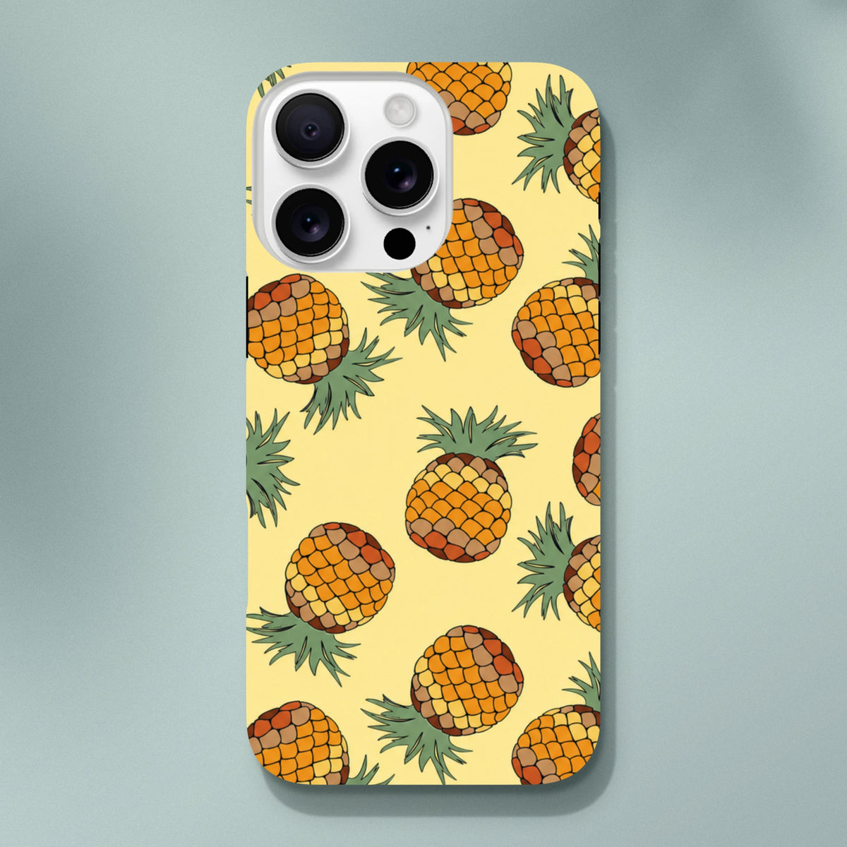Yellow pineapple tough iPhone case with tropical fruit pattern. Durable street-ready phone cover for iOS 13-16.