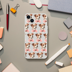Slim transparent iPhone case for 13-16 with repeating dog faces wearing pink bows.
