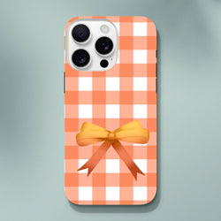 Orange gingham iPhone case featuring a 3D bow and tough, impact-resistant protection in a cute coquette style.