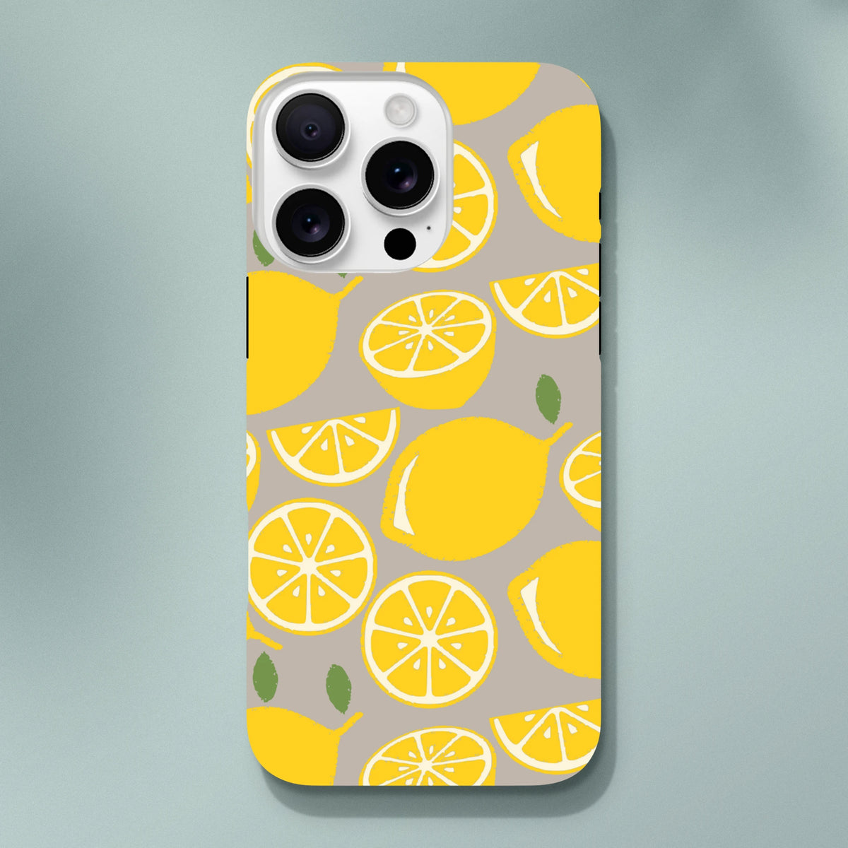 Cute yellow lemon tough iPhone case with citrus fruit pattern on beige background for drop protection.