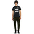 Male model wearing black graphic T-shirt with bold white text "Over thinking solves nothing".