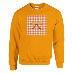 Orange pullover sweatshirt featuring a gingham square graphic with a 3D bow, perfect for cute coquette aesthetic streetwear layering.
