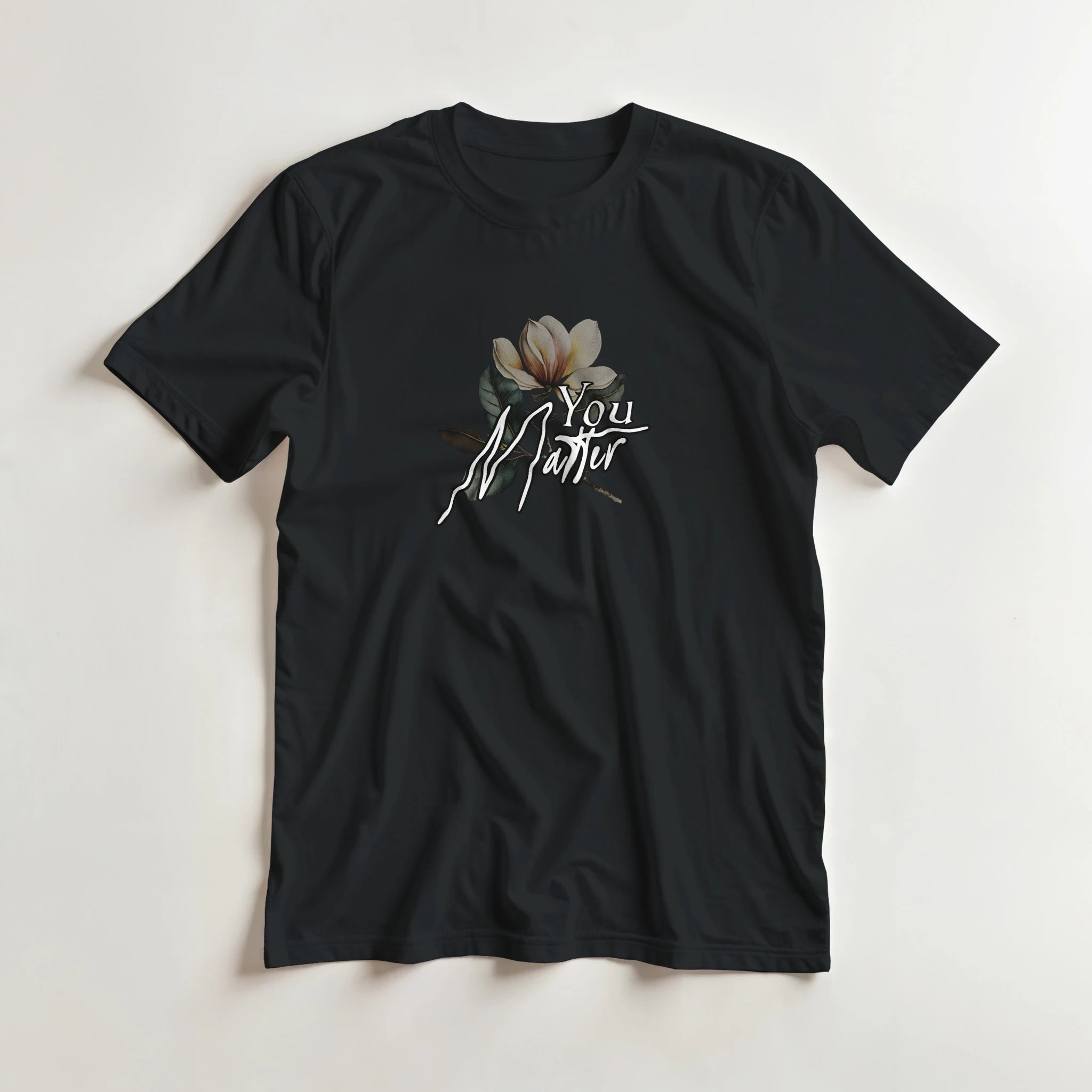 Black men's graphic tee with You Matter slogan and magnolia flower on soft cotton blend.