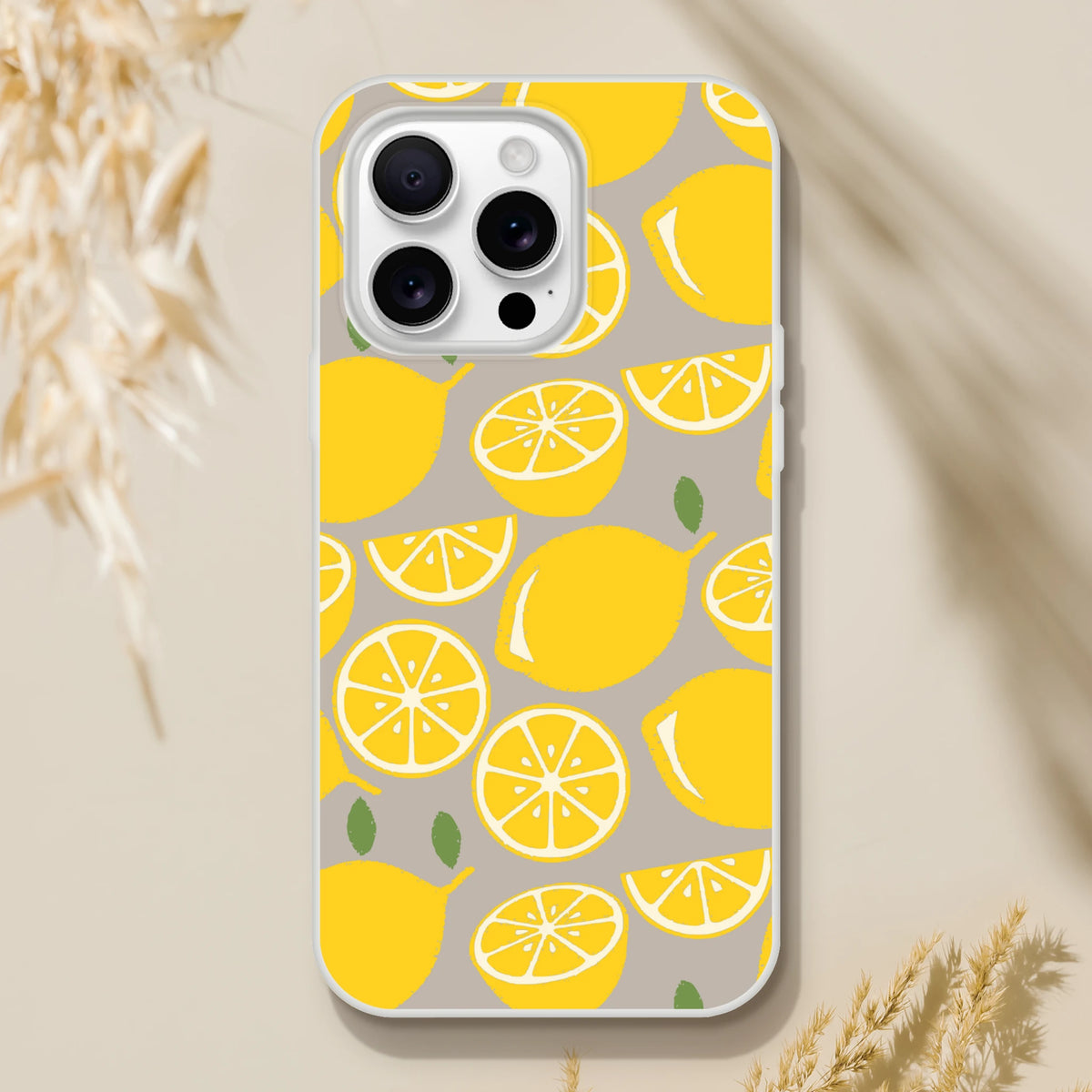 Lemon-slice patterned iPhone case for iPhone 13–16, yellow citrus on a gray background.