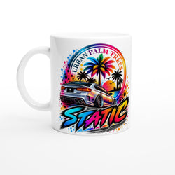 White static petrolhead mug featuring a vibrant retro car design with palm trees and urban text for car enthusiasts.