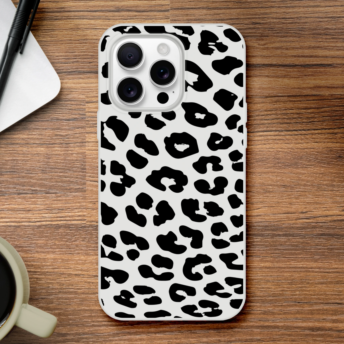 Retro Snow Leopard iPhone Case (13-16) with black spots on light gray, bold animal aesthetic phone cover.