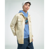 Male model wearing blue Urban Teddy Bear hoodie with bear graphic, layered over a beige overshirt and white beanie.