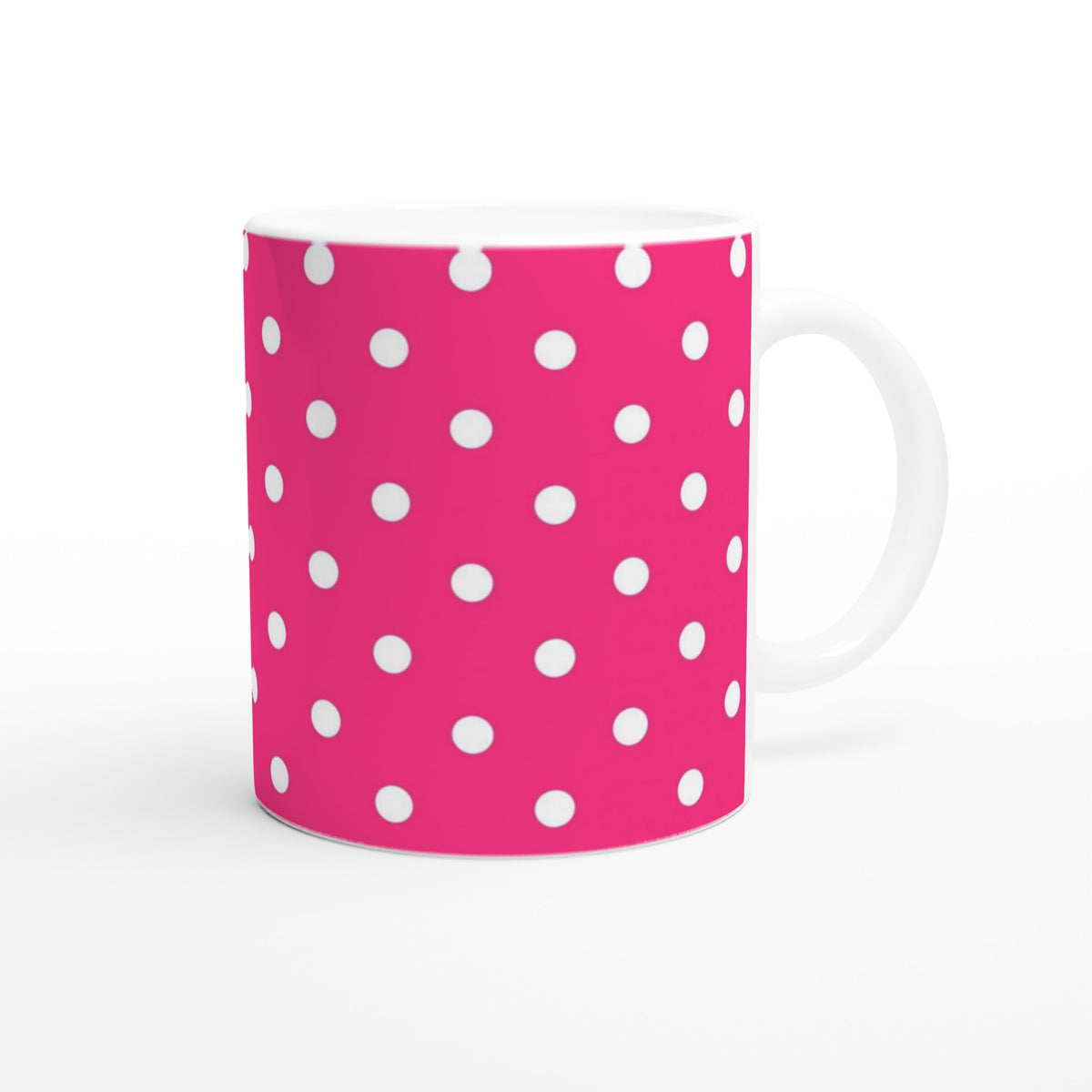 Retro hot pink ceramic mug with white polka dot pattern. Spotty coffee cup for daily brews, office use, or gifting.