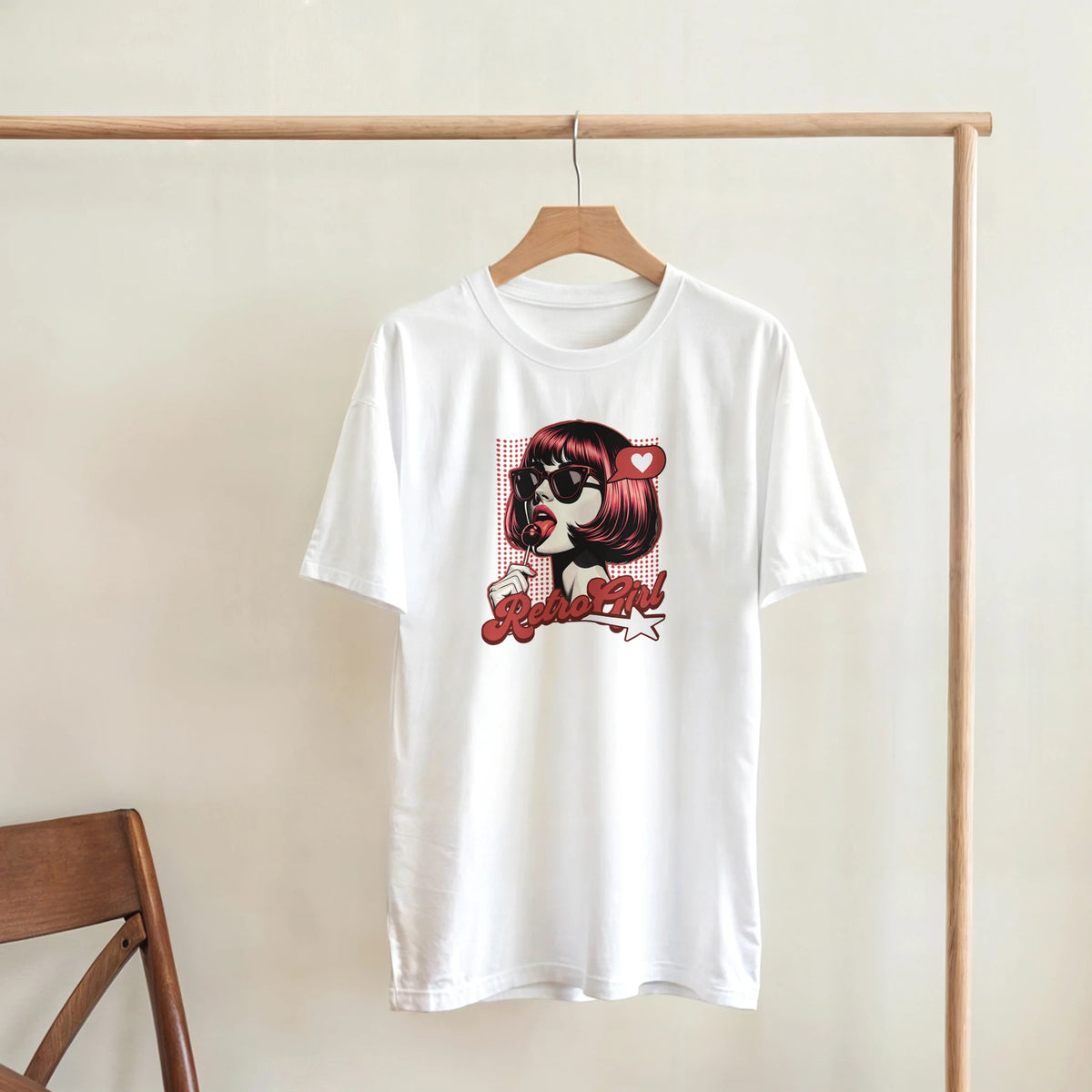 White women's tee featuring retro pop art graphic of girl with sunglasses and lollipop, labeled Retro Girl in red script.