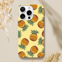 Yellow pineapple tropical iPhone case featuring a vibrant fruit pattern on a light background for impact protection.