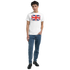 Man in white T-shirt with Union Jack Make Britain Great Again slogan, men's graphic cotton-blend tee.