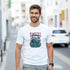 Man in white Japanese Sakura graphic T-shirt with cherry blossom landscape.