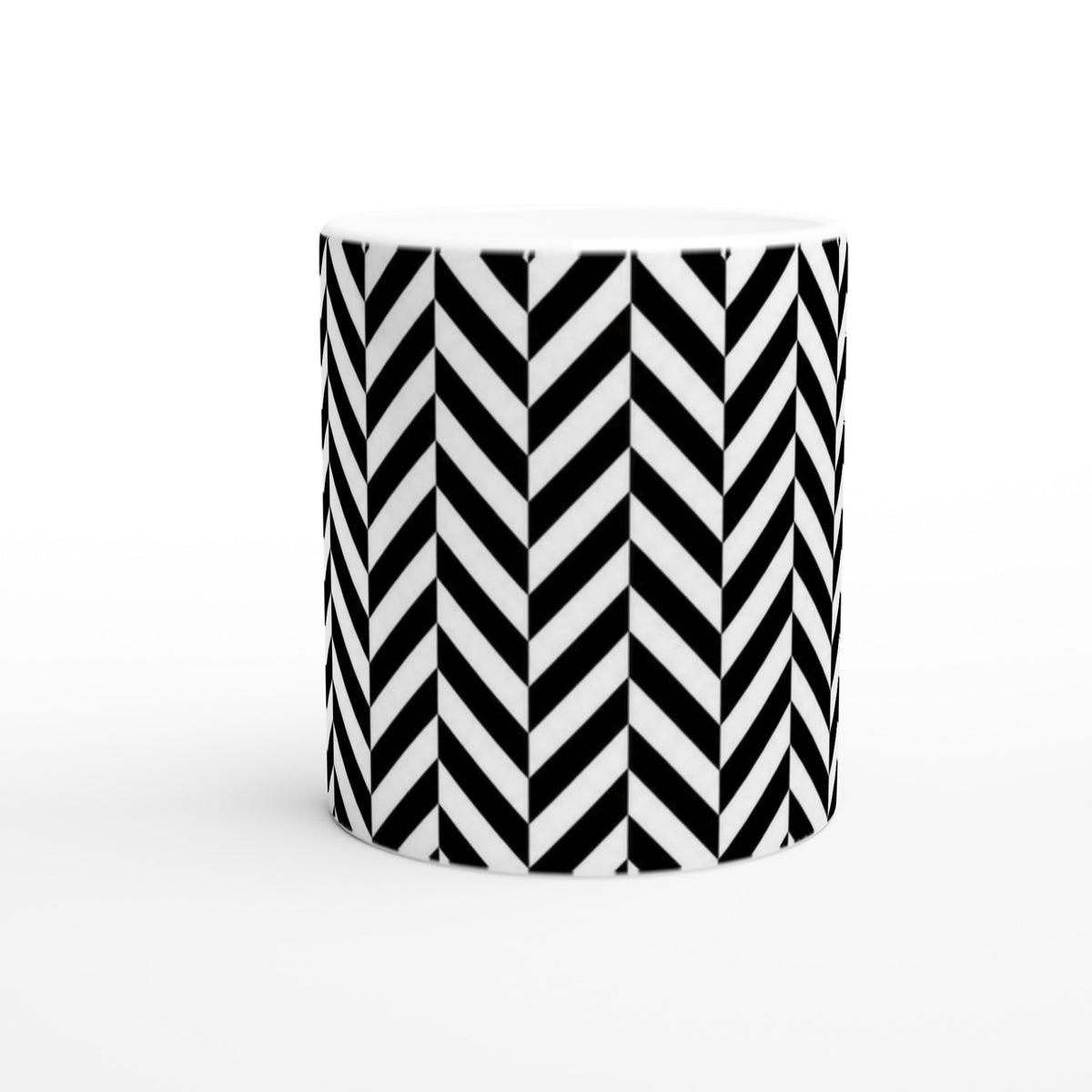 Black and white herringbone ceramic coffee mug with a bold geometric chevron pattern for daily use.