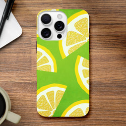 Green iPhone case featuring a bold yellow lemon slice pattern. Shock-absorbing citrus fruit phone cover for durable protection.