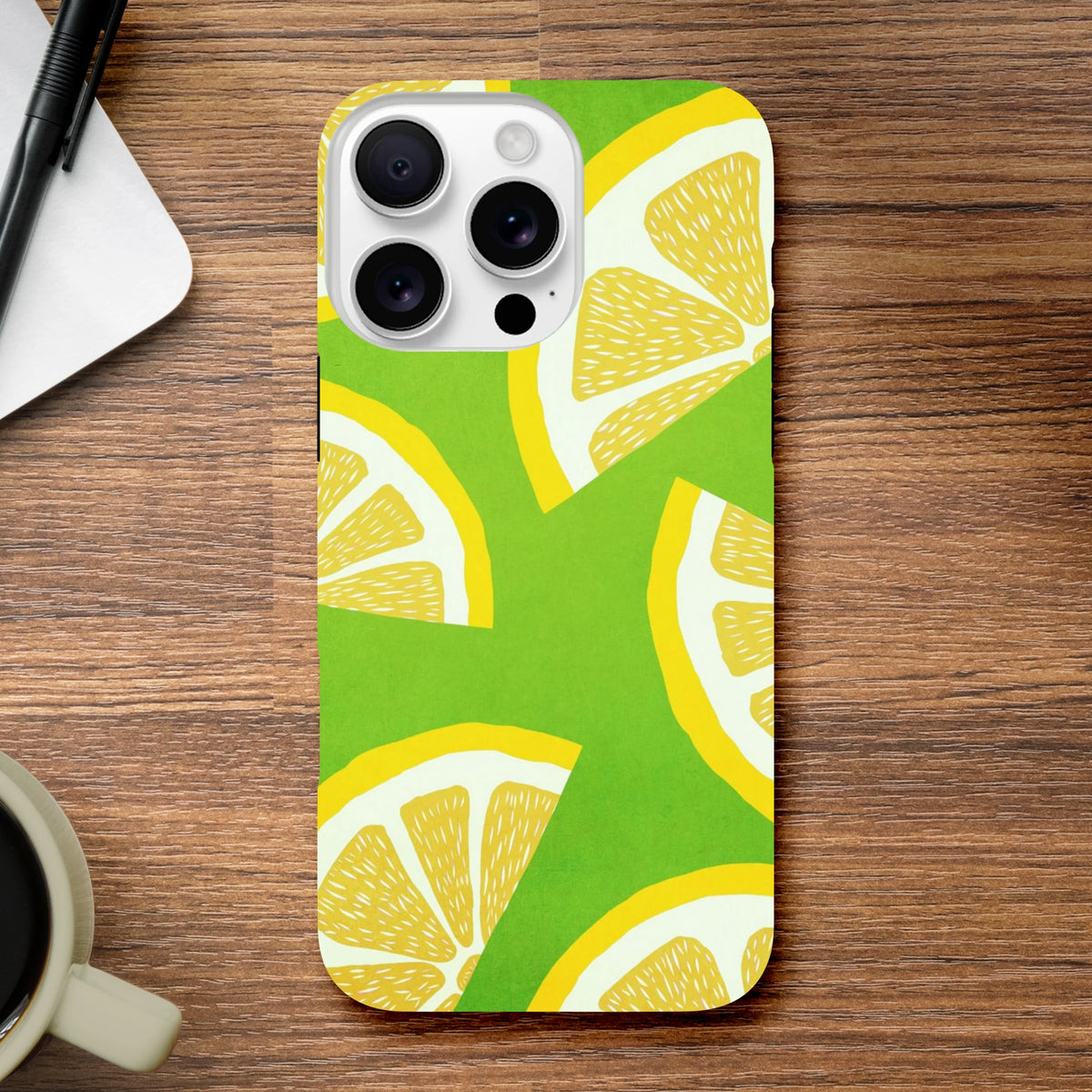 Green iPhone case featuring a bold yellow lemon slice pattern. Shock-absorbing citrus fruit phone cover for durable protection.