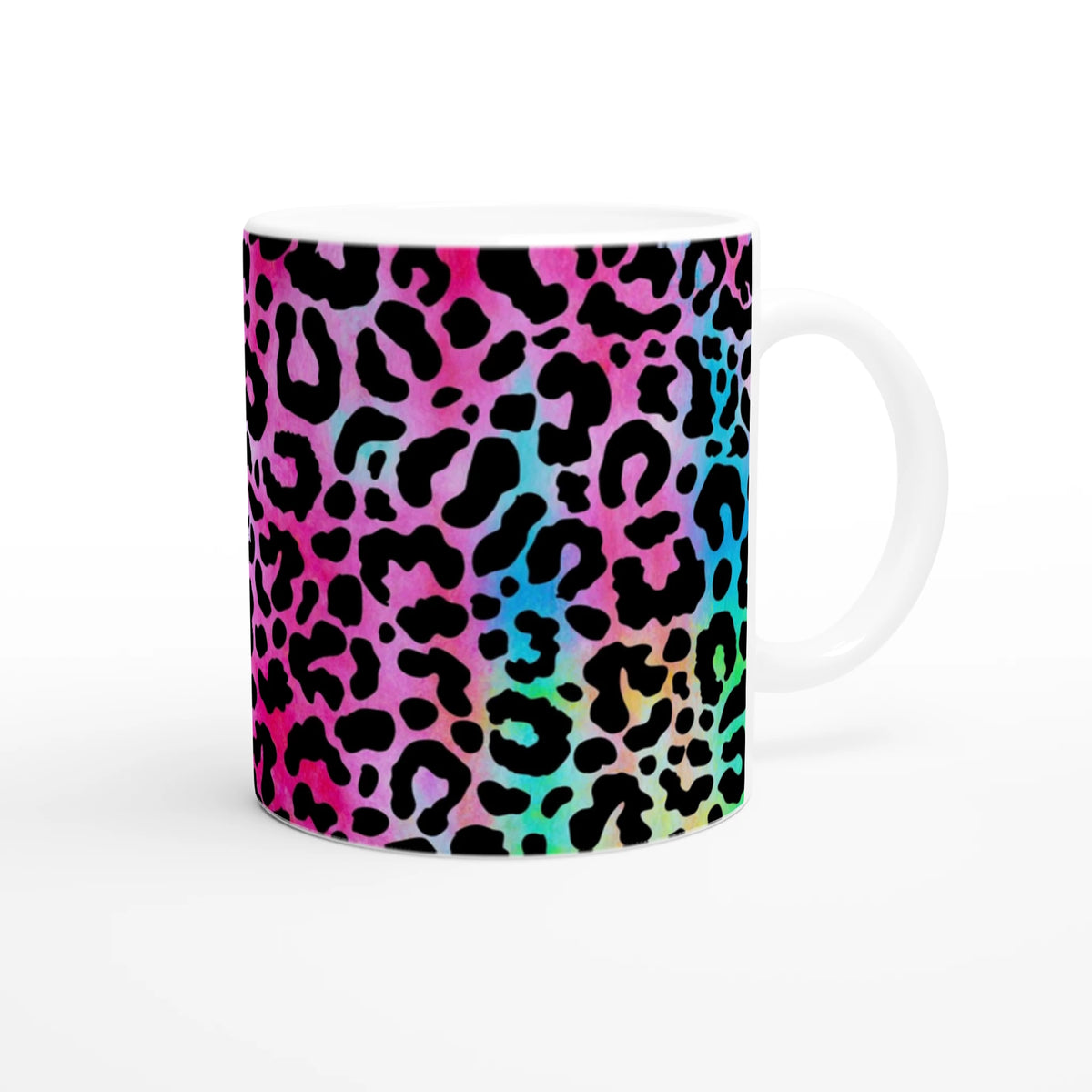 Rainbow leopard-print mug with white handle for coffee or tea.