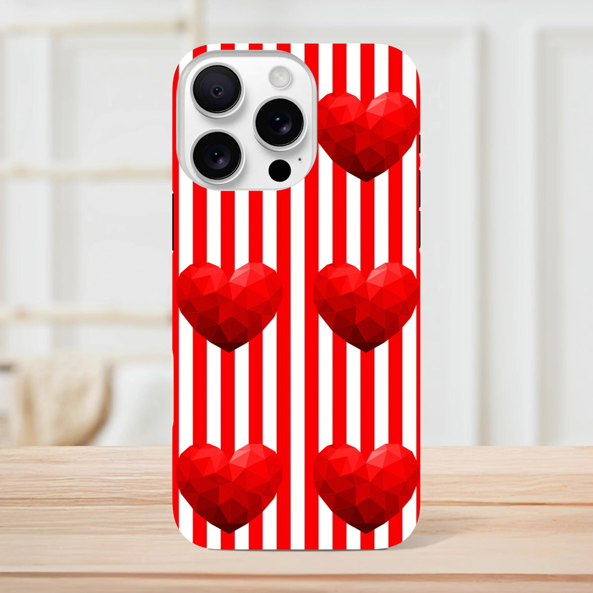 Red and white striped iPhone case with faceted red heart graphics. Retro love tough phone cover for iPhone 13-16.