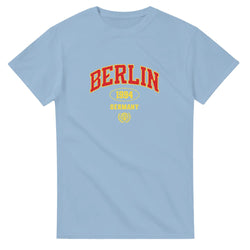 Light blue Berlin graphic T-shirt with red BERLIN lettering and yellow 1994 Germany emblem on chest.