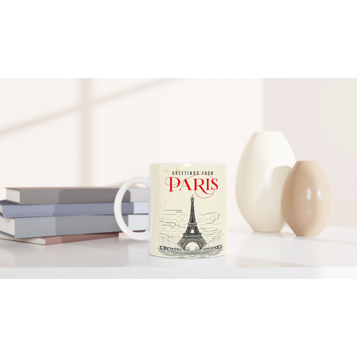 Vintage Paris mug featuring Eiffel Tower postcard design on a tidy desk with books.