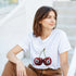 Lucky Cherries T Shirt: white women's graphic tee with two cherries, soft cotton blend, relaxed fit.