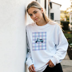 White vintage mod graphic jumper featuring a retro scooter print on a blue and purple gingham background.