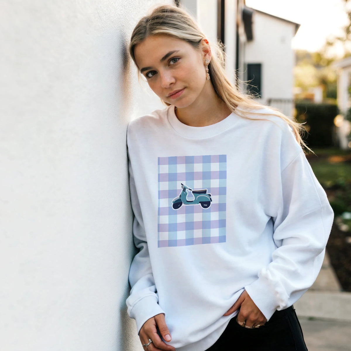 White vintage mod graphic jumper featuring a retro scooter print on a blue and purple gingham background.
