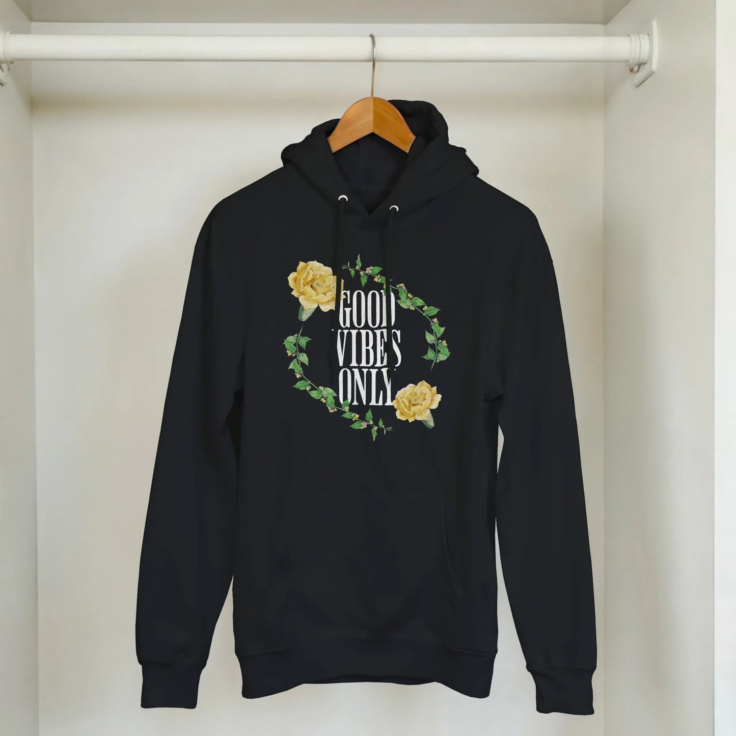 Black hoodie with Good Vibes Only slogan encircled by yellow rose vine, 50/50 cotton-poly blend, front pocket