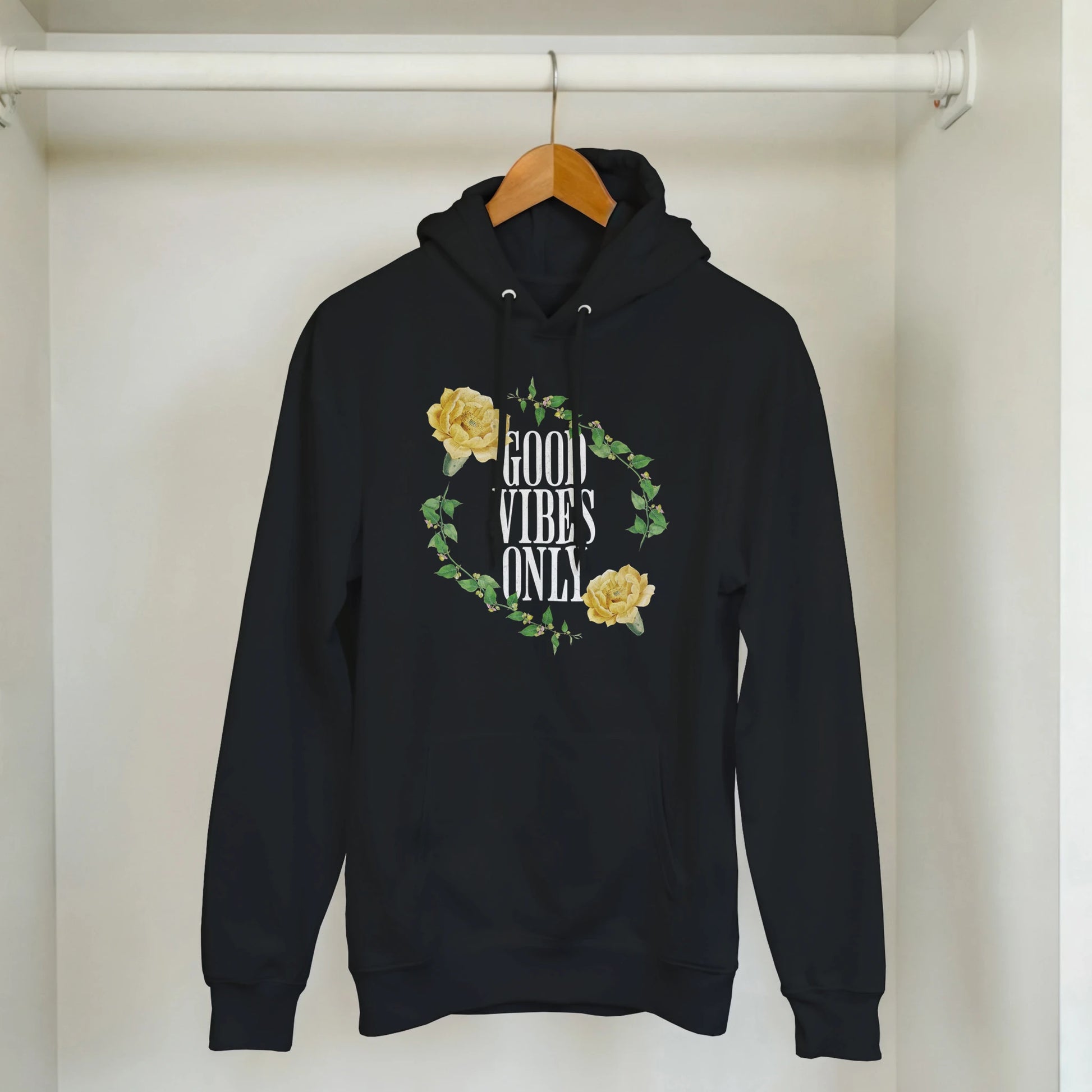 Black hoodie with Good Vibes Only slogan encircled by yellow rose vine, 50/50 cotton-poly blend, front pocket