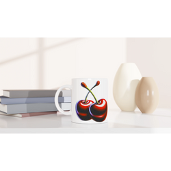 Cute Cherry Mug with retro aesthetic cherry print on white ceramic beside stacked books.