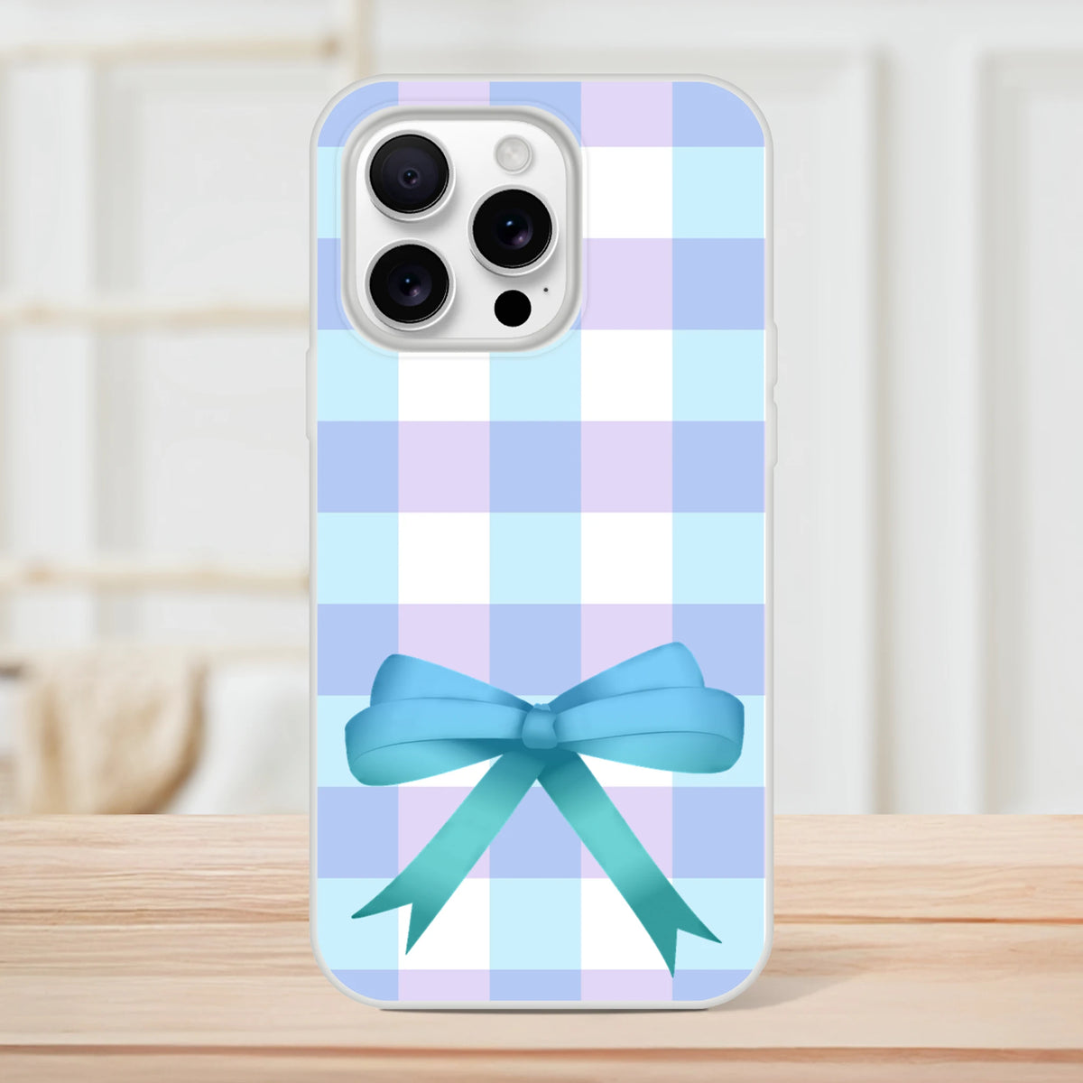 Blue gingham bow iPhone case for iPhone 13-16, pastel checkered pattern with a cute blue bow.