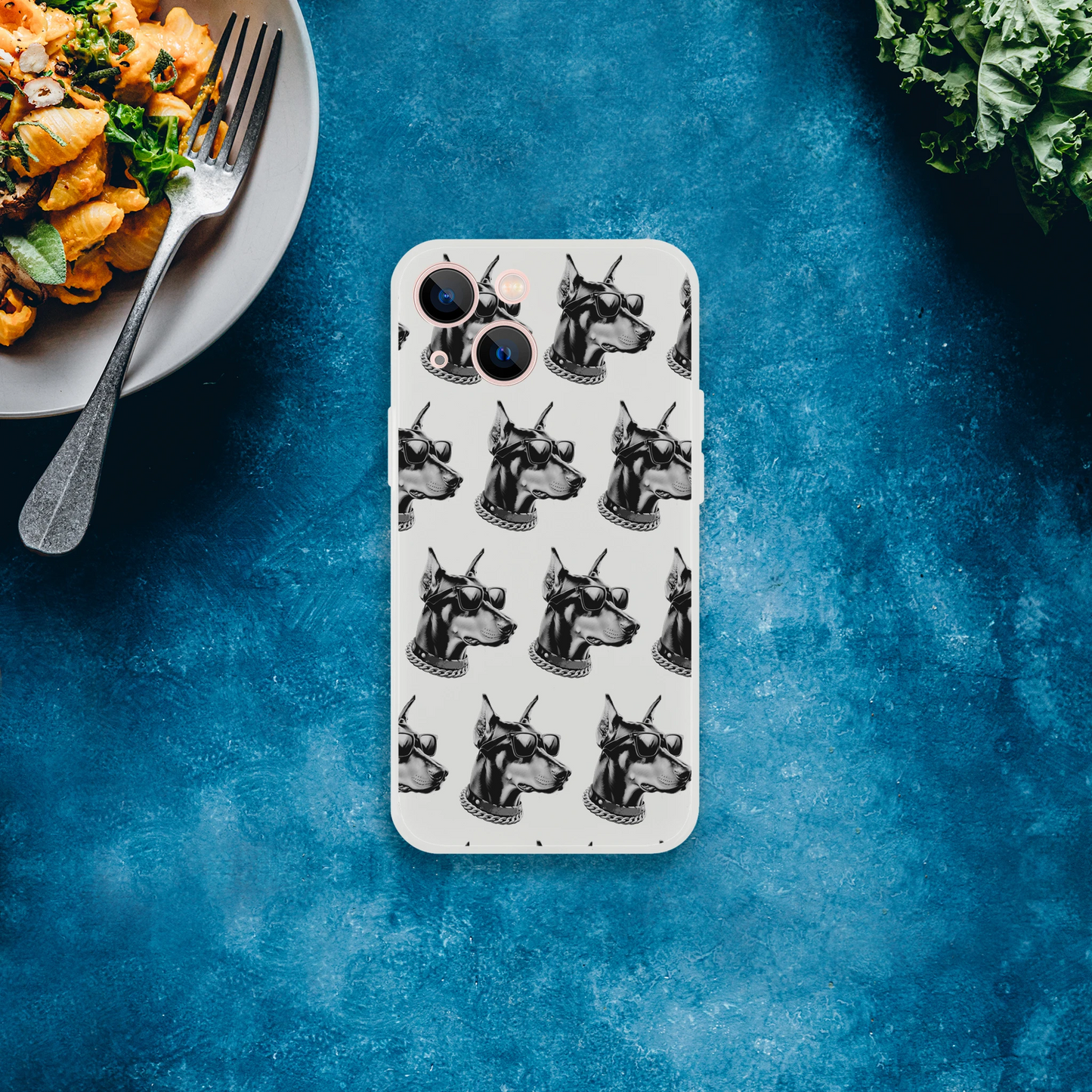 Gangster Dog iPhone case for 13-16, slim clear protective cover with repeating dog heads wearing sunglasses and chains.