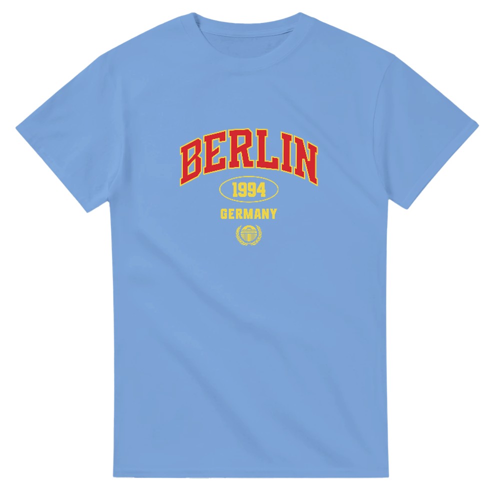 Blue women's Berlin graphic T-shirt with red BERLIN lettering and yellow 1994 Germany emblem in a soft cotton blend.