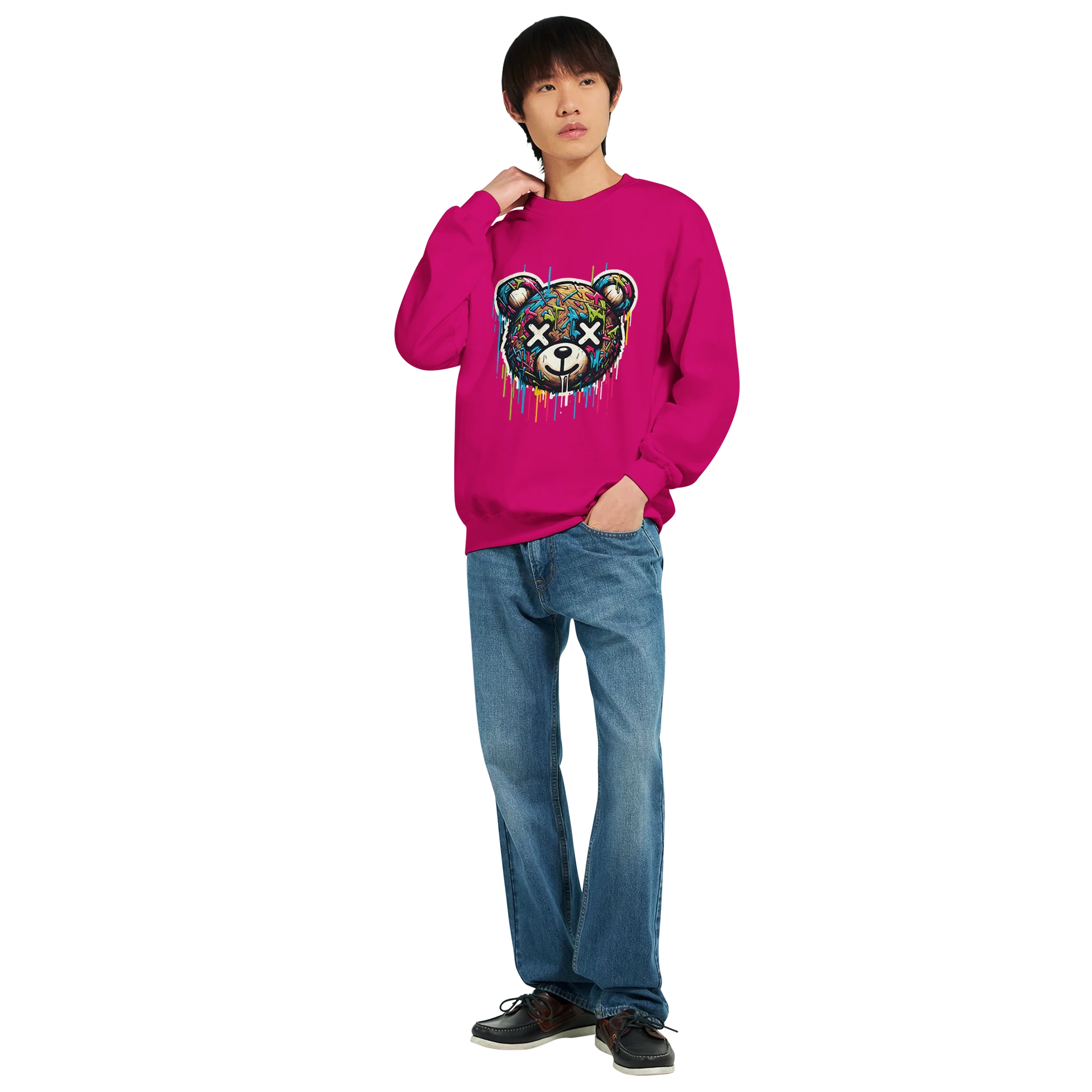 Man wearing bright pink Teddy Bear graphic sweatshirt with dripping paint design, paired with jeans.