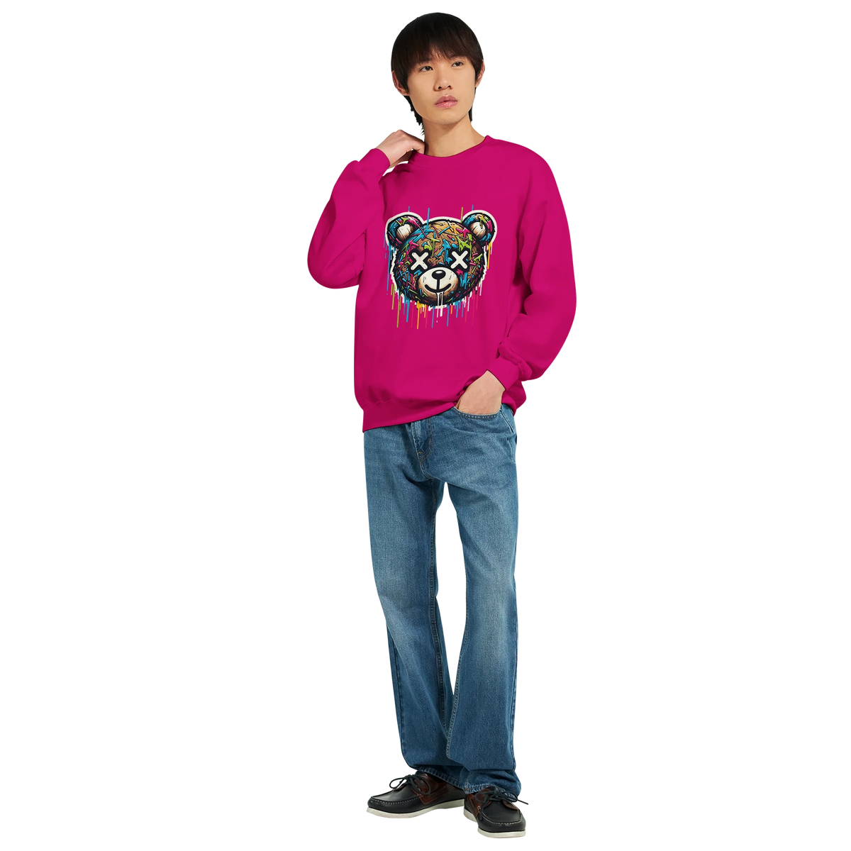 Man wearing bright pink Teddy Bear graphic sweatshirt with dripping paint design, paired with jeans.