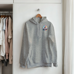 Grey petrolhead streetwear hoodie with colorful palm tree graphic, front pouch pocket, and drawstrings hanging in a wardrobe.