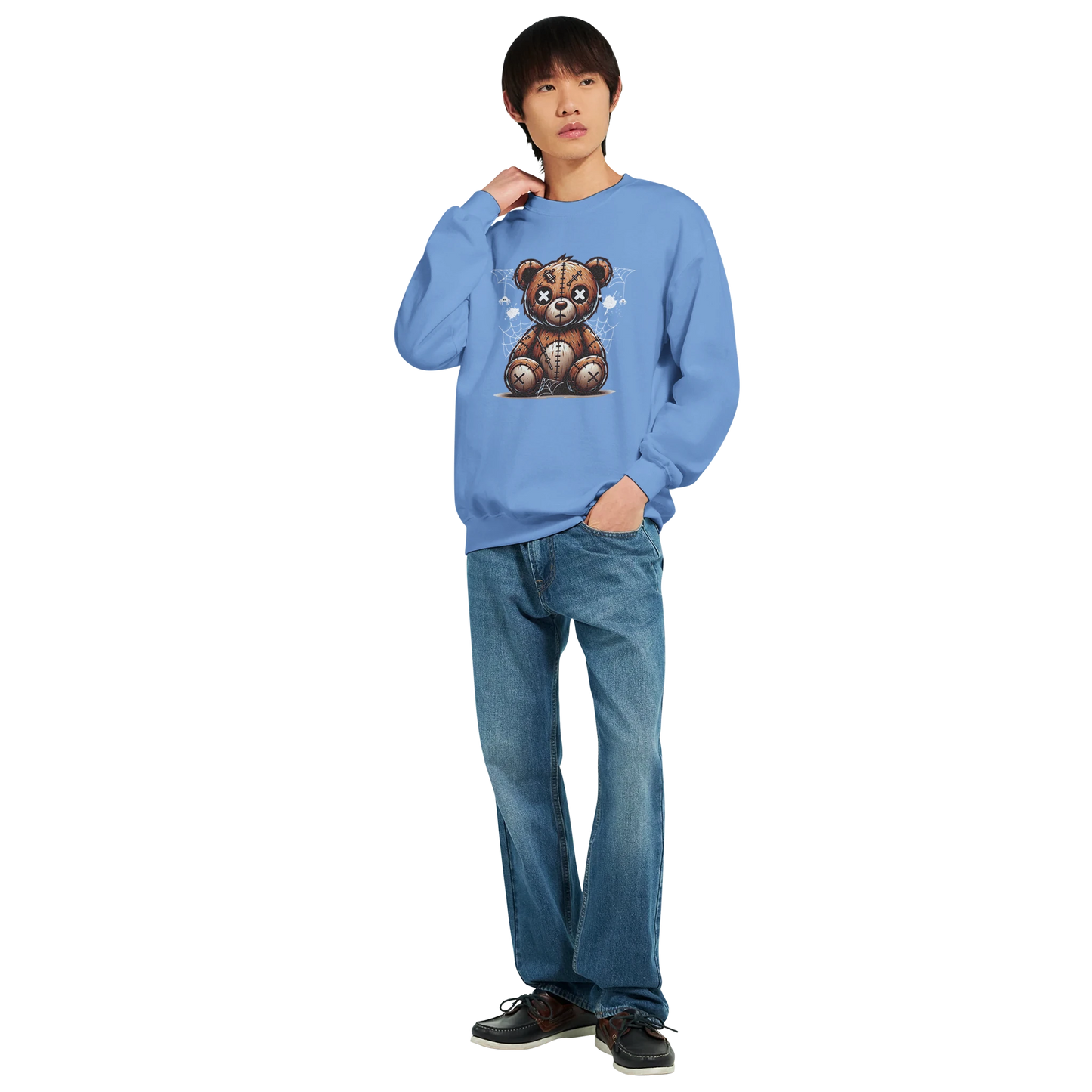 Person wearing a blue men's graphic sweatshirt with a teddy bear graphic on a white background