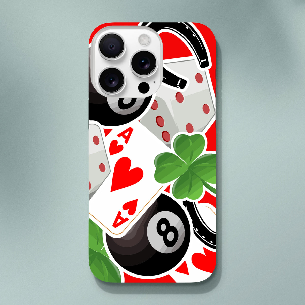 iPhone case featuring a sticker-bomb design with an Ace of Hearts, four-leaf clover, 8-ball, and horseshoe on a red background.