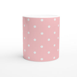 Pastel pink and white polka dot ceramic mug with a cute retro design for daily coffee or tea.