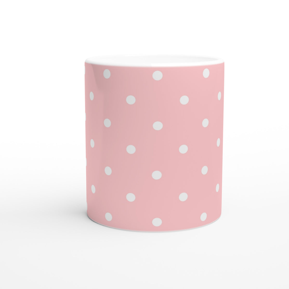 Pastel pink and white polka dot ceramic mug with a cute retro design for daily coffee or tea.
