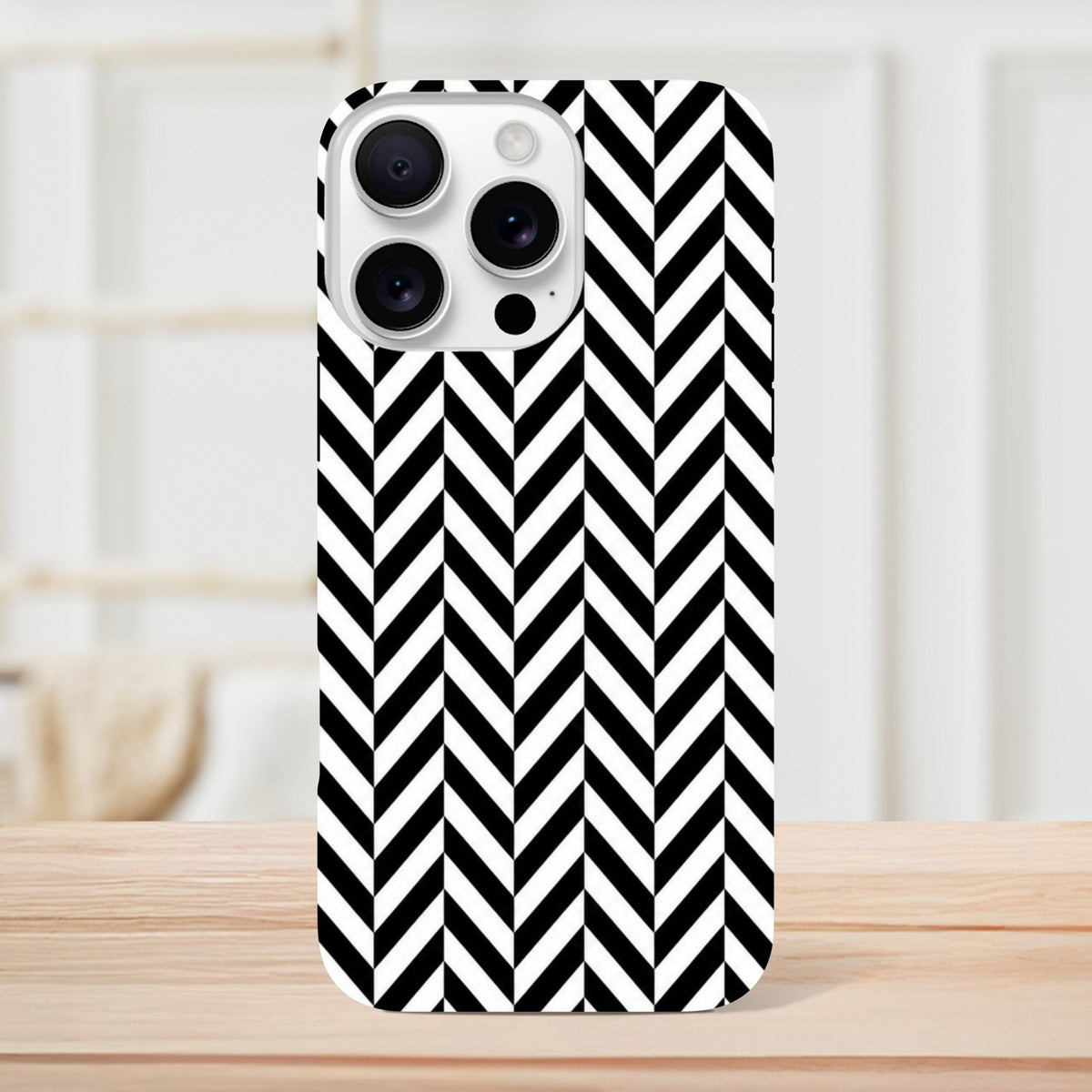 Black and white herringbone iPhone case featuring a geometric chevron pattern. Tough dual-layer protective shell with shock-absorbing TPU for daily use.