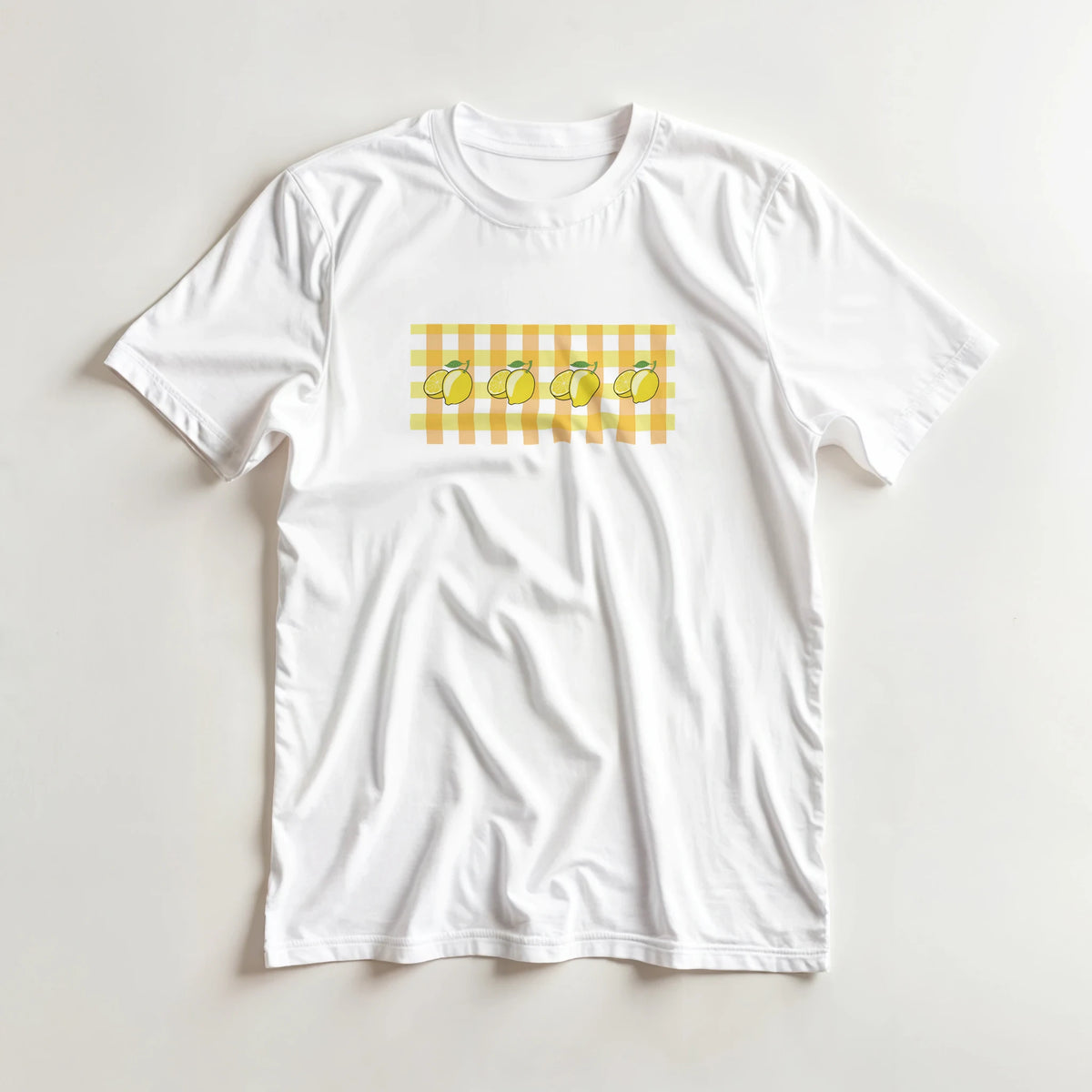 White women's T-shirt with yellow gingham pattern and lemon graphics.