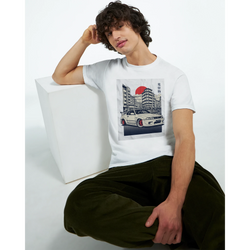 Man wearing Car T Shirt with JDM graphic on white soft cotton tee featuring a car and cityscape.