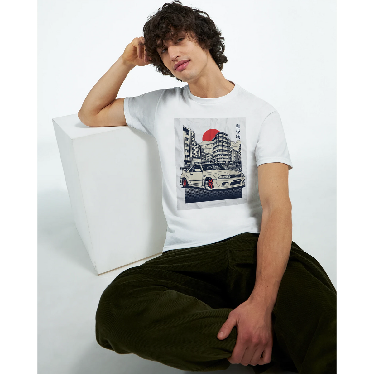 Man wearing Car T Shirt with JDM graphic on white soft cotton tee featuring a car and cityscape.