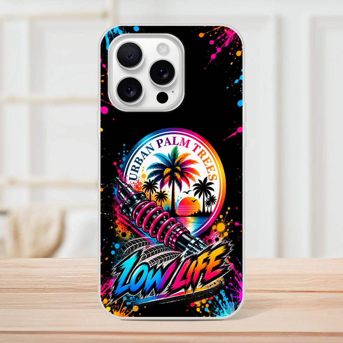 Low Life car culture iPhone case featuring Urban Palm Trees graphic, shock absorber art, and vibrant neon splatter design.