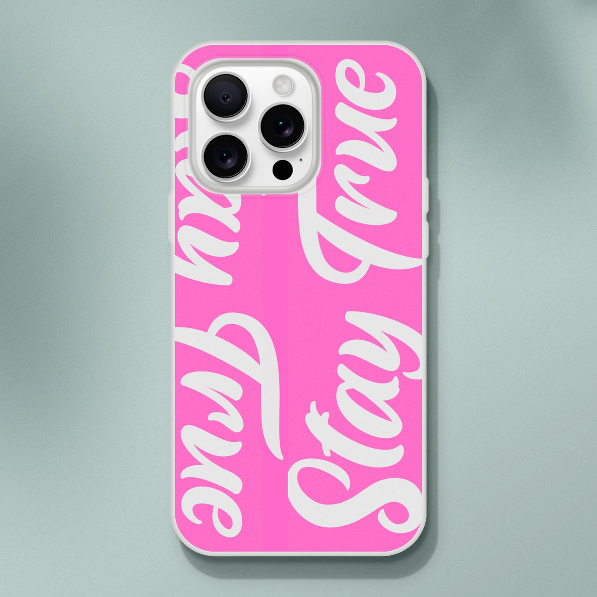 Pink Stay True iPhone case for 13-16 with white cursive slogan text.