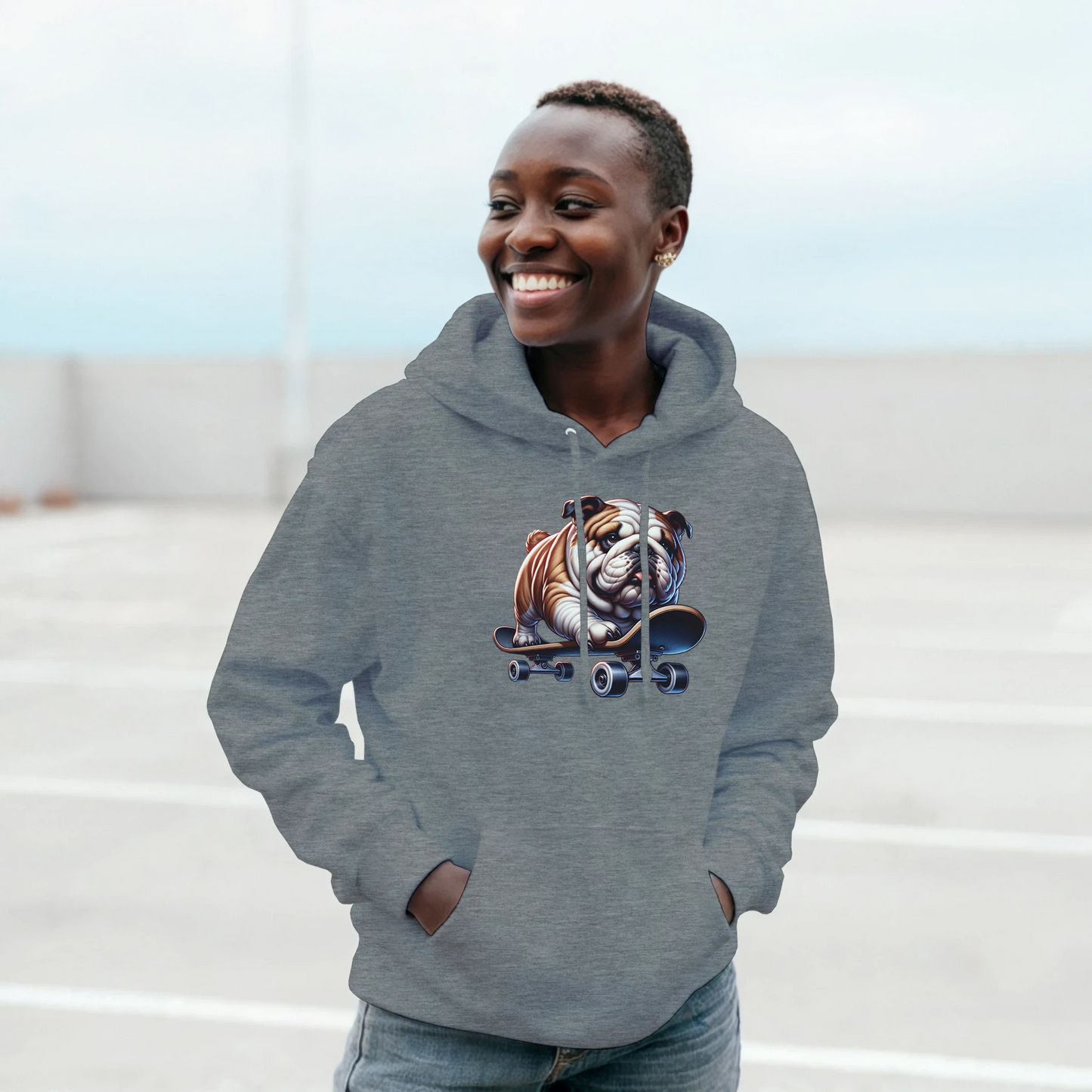 Smiling woman wearing a gray hoodie with a skateboarding bulldog graphic.