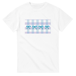 White T-shirt with pastel blue and lavender gingham panel and blue bows across the front.